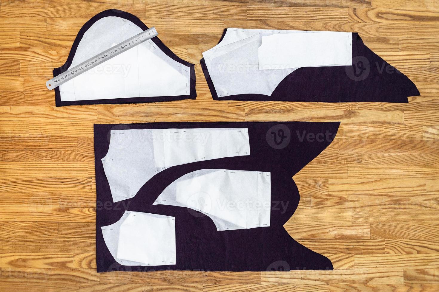 top view of layouts of sewing patterns on table photo