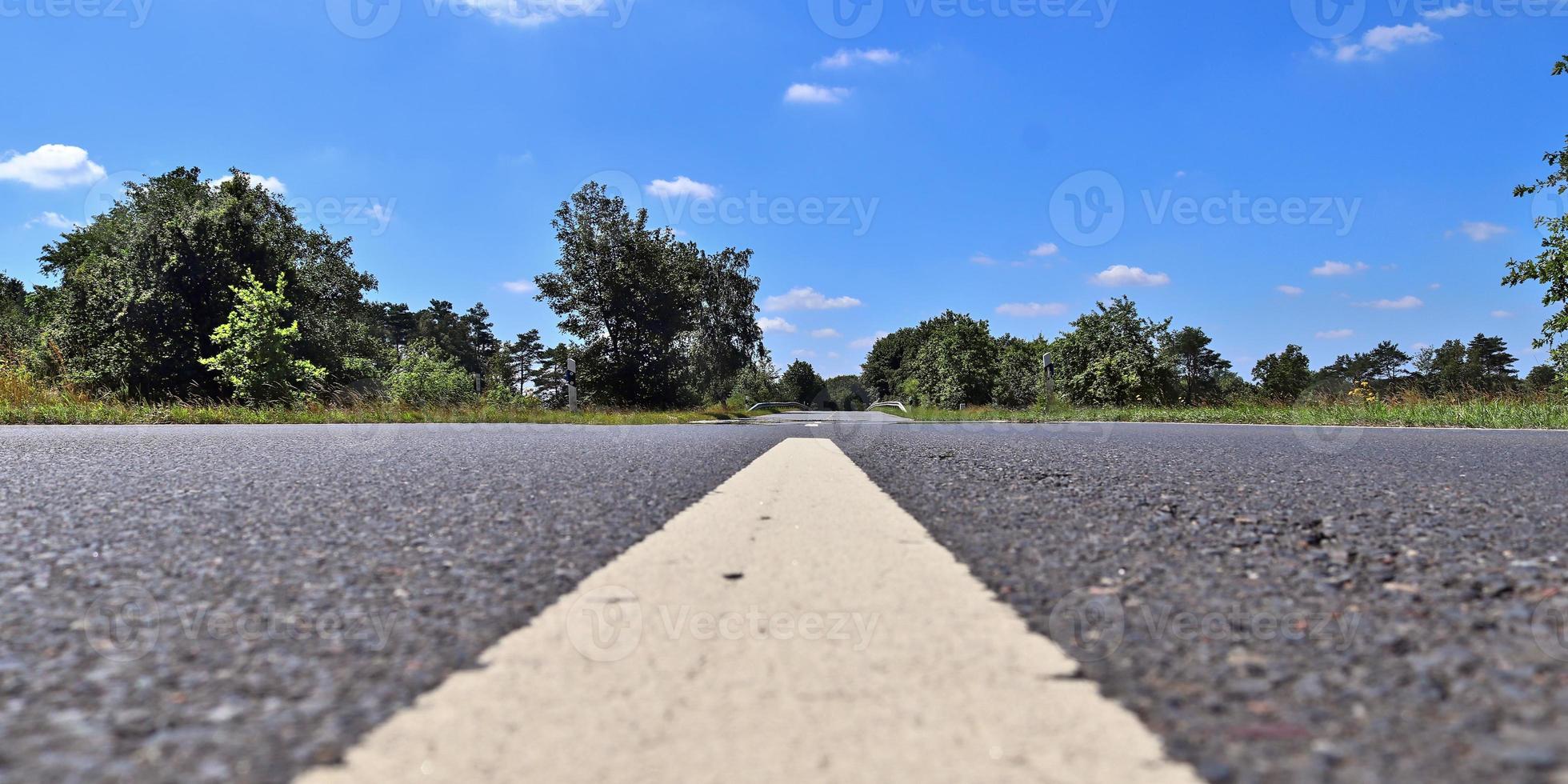 Beautiful view on countryside roads with fields and trees in northern europe photo