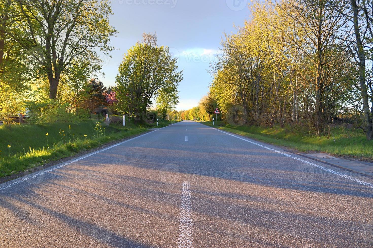 Beautiful view on countryside roads with fields and trees in northern europe photo