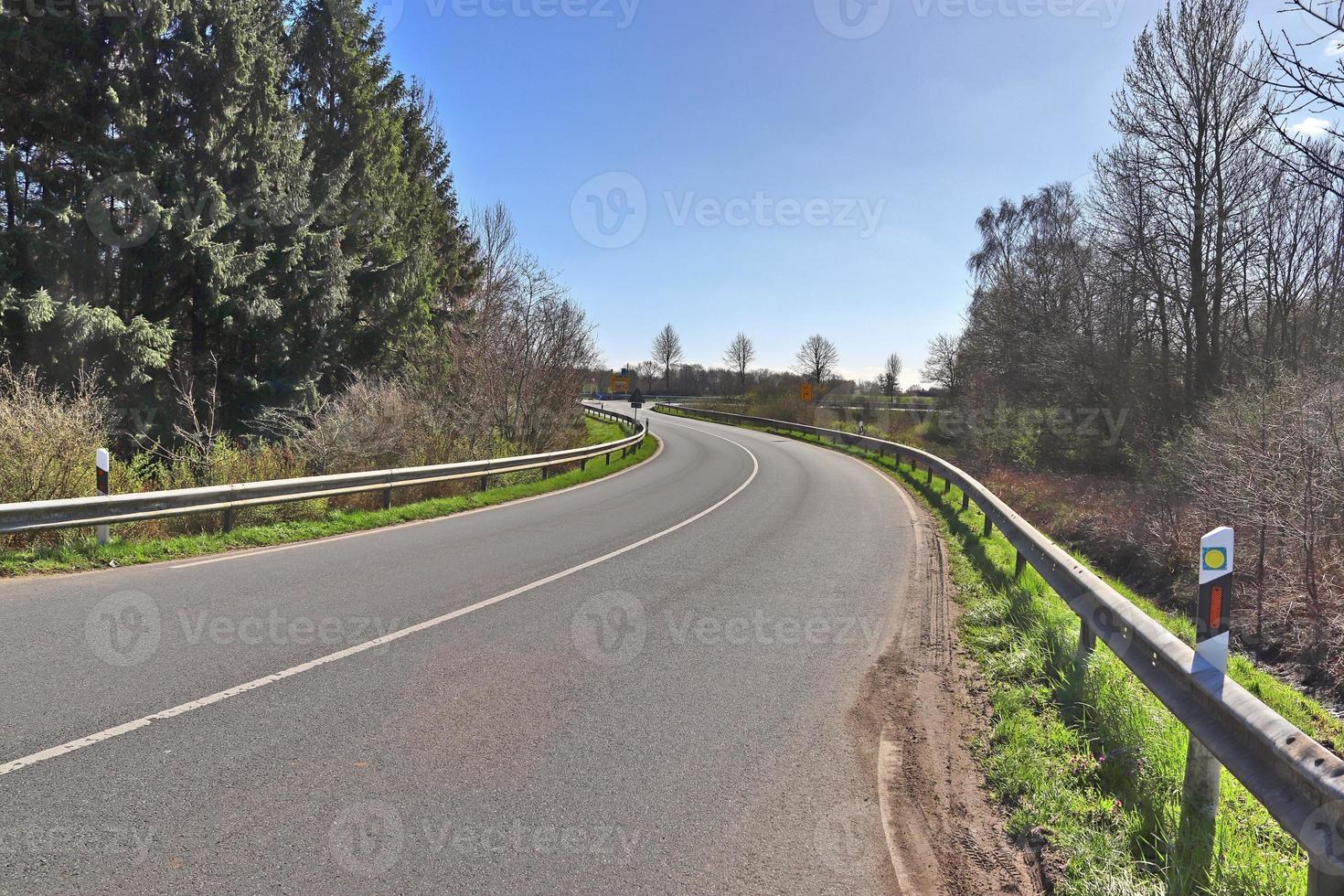 Beautiful view on countryside roads with fields and trees in northern europe photo