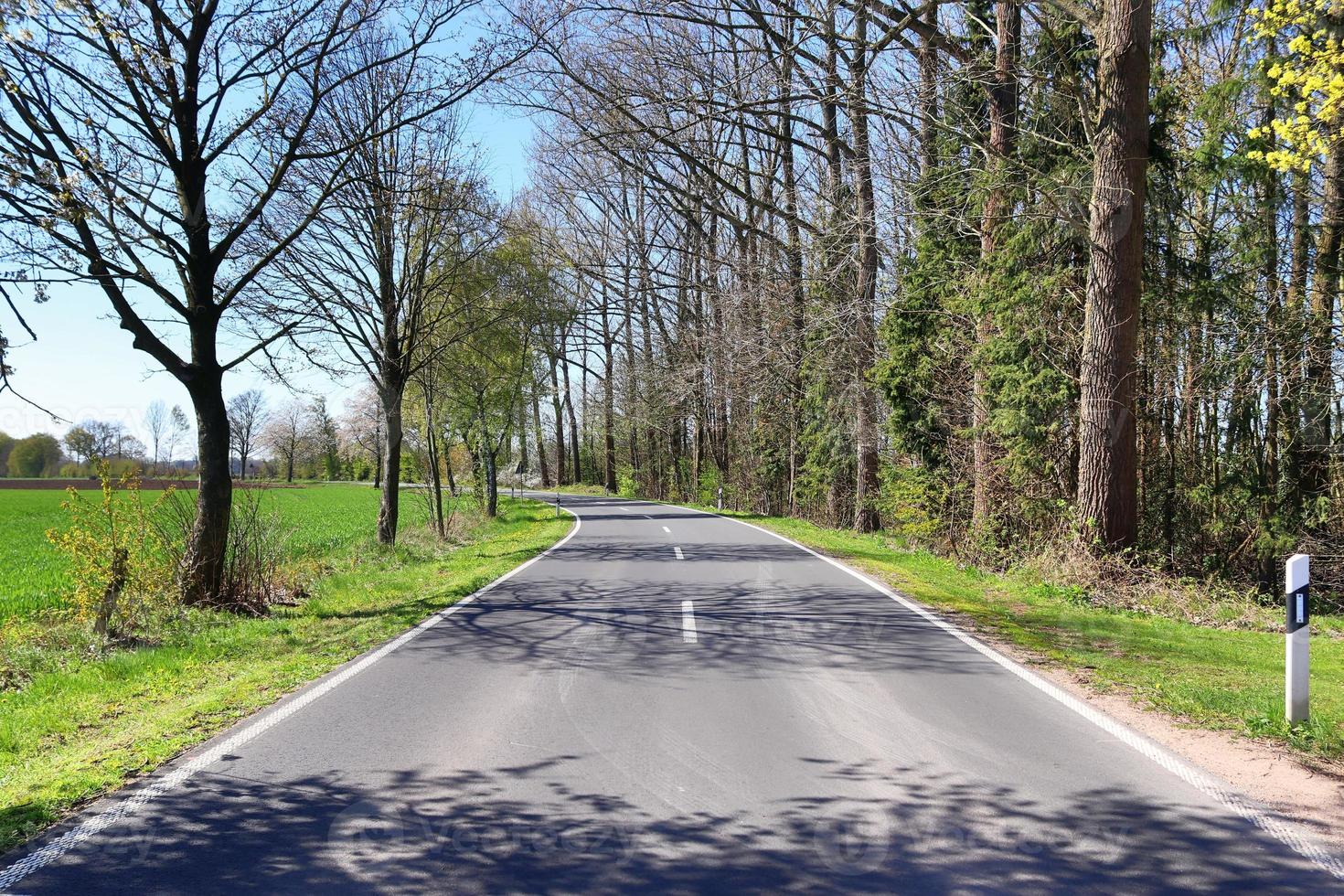Beautiful view on countryside roads with fields and trees in northern europe photo