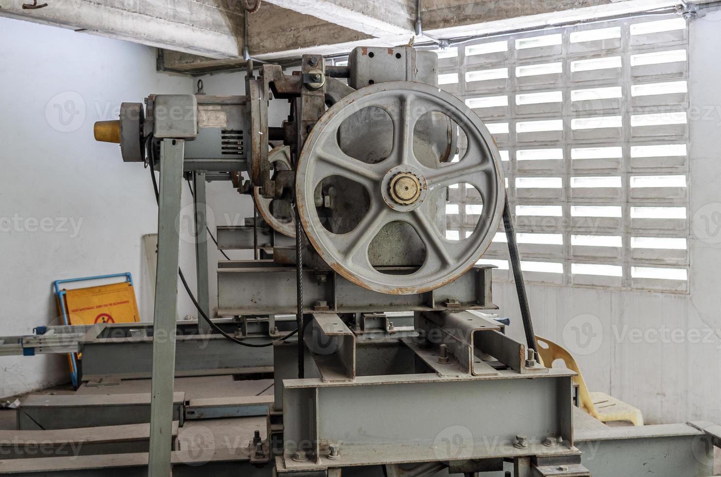 Elevator motor in elevator engine room photo