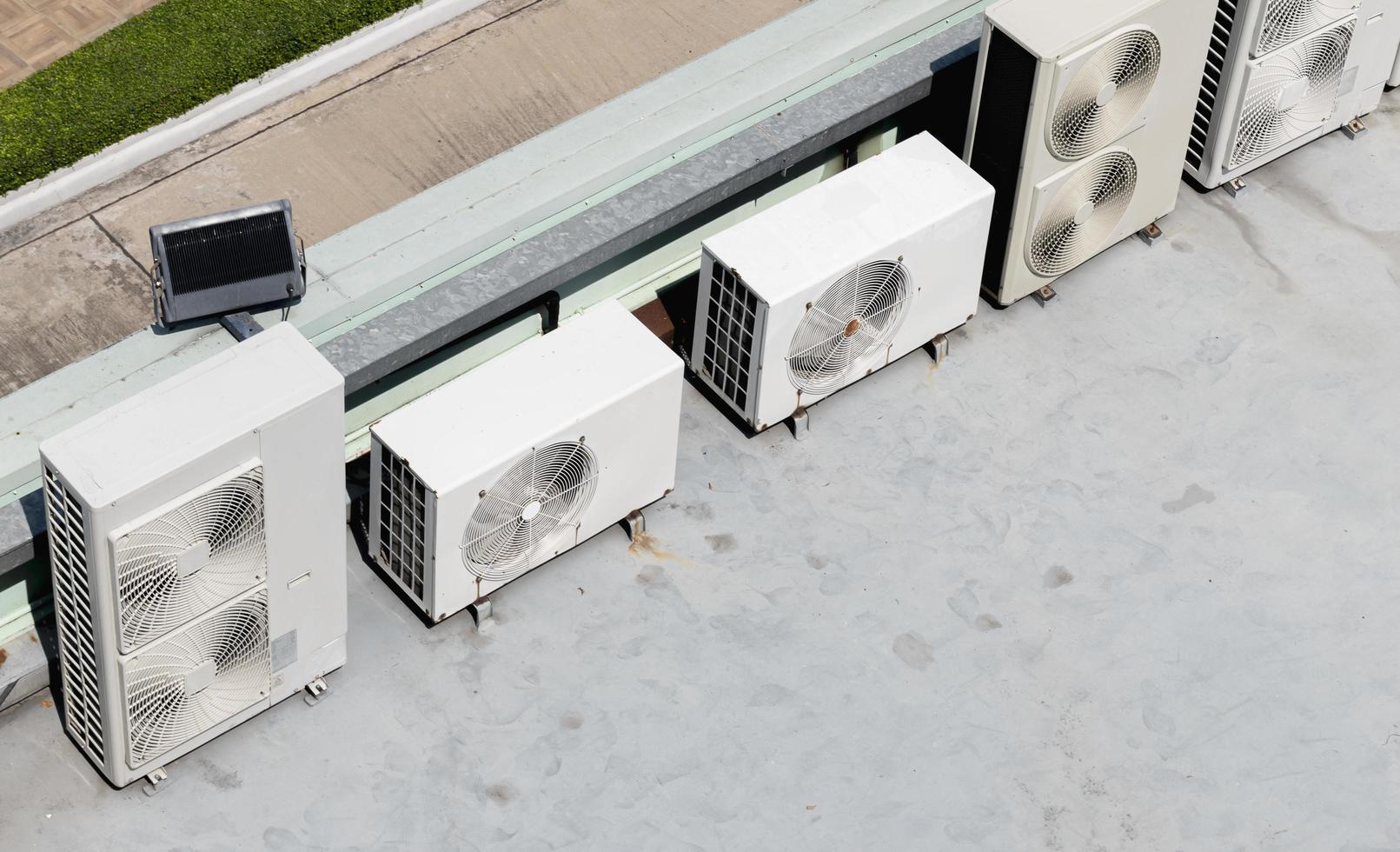 Air compressor on rooftop building photo