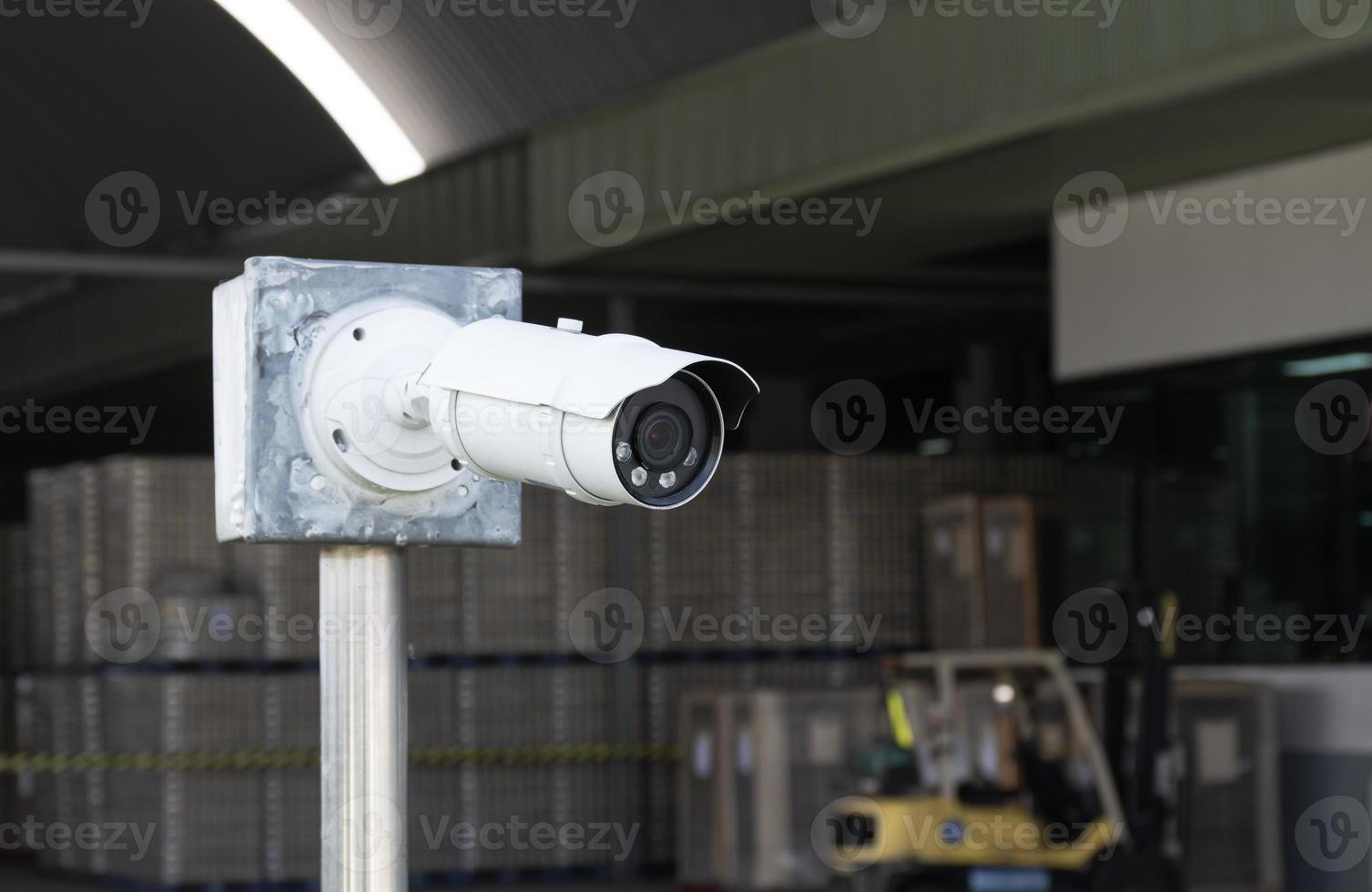 Outdoor white CCTV on pole photo
