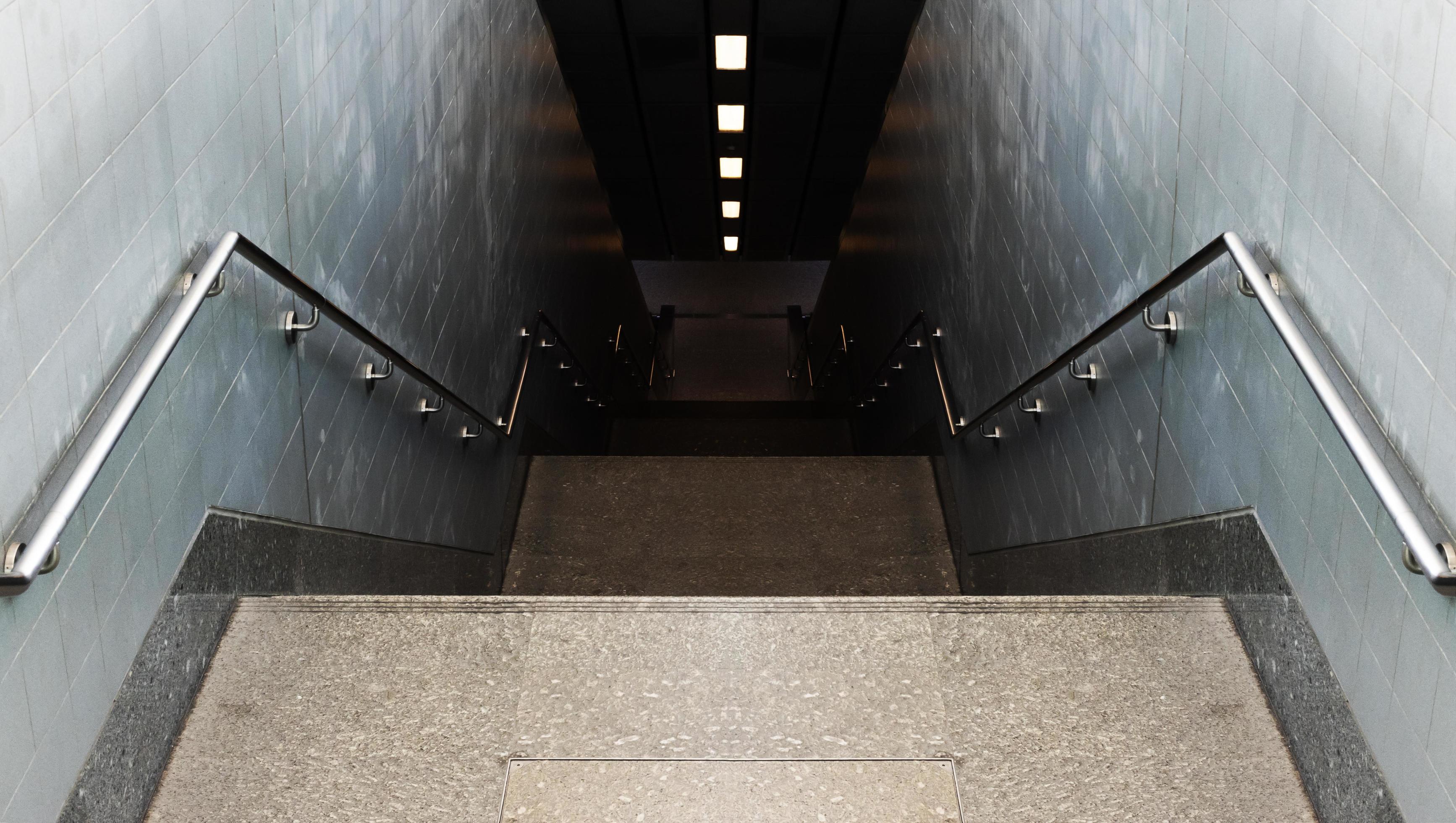 Looking down passageway stairs to subway station 11374688 Stock Photo