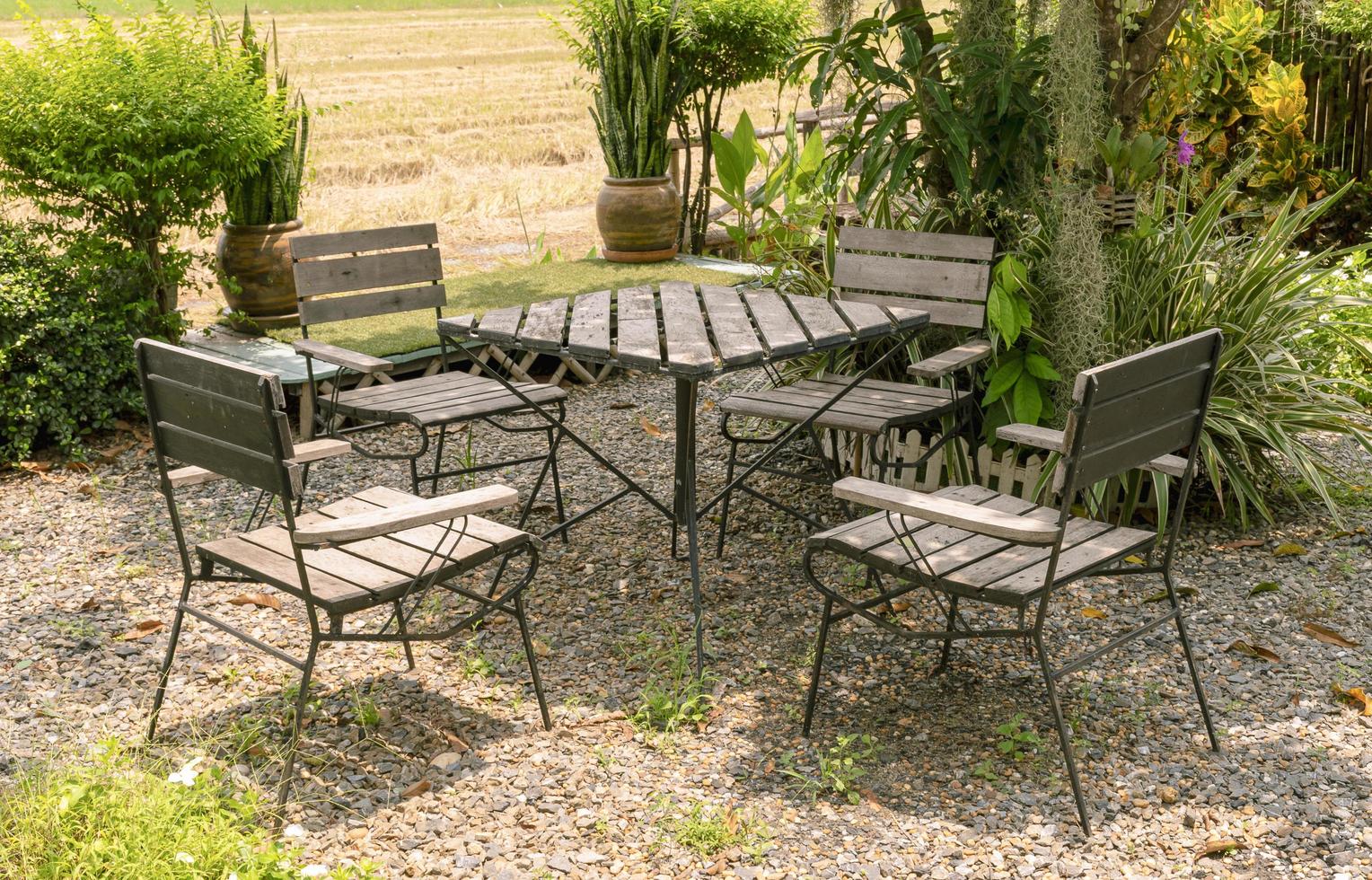 Outdoor wooden chair and table at lawn coffee shop photo