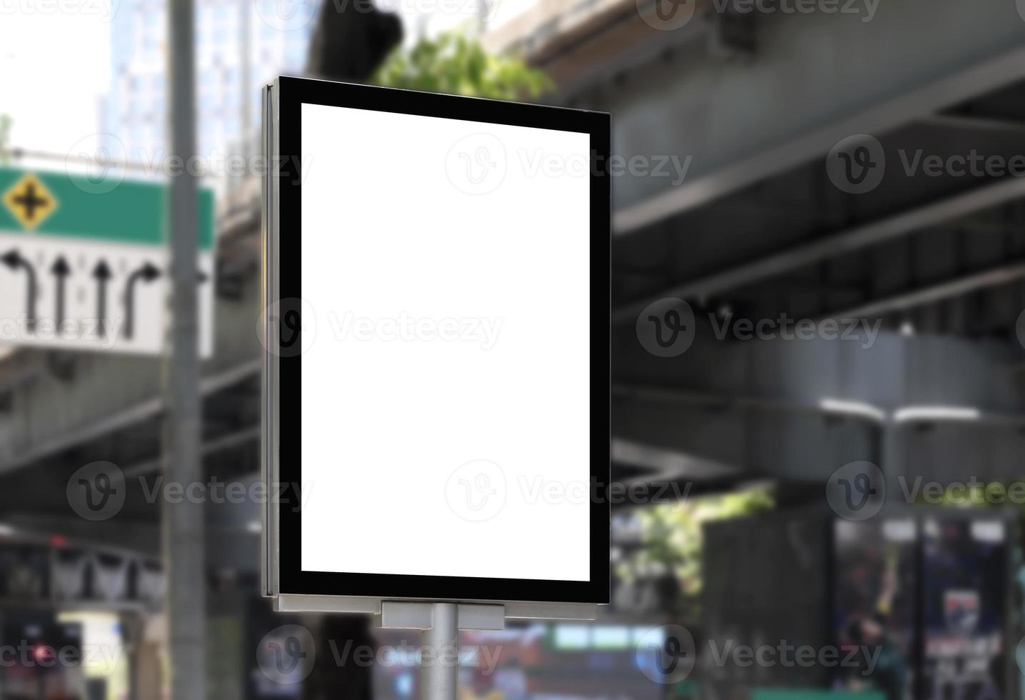 Outdoor pole billboard with mock up white screen on footpath and clipping path photo