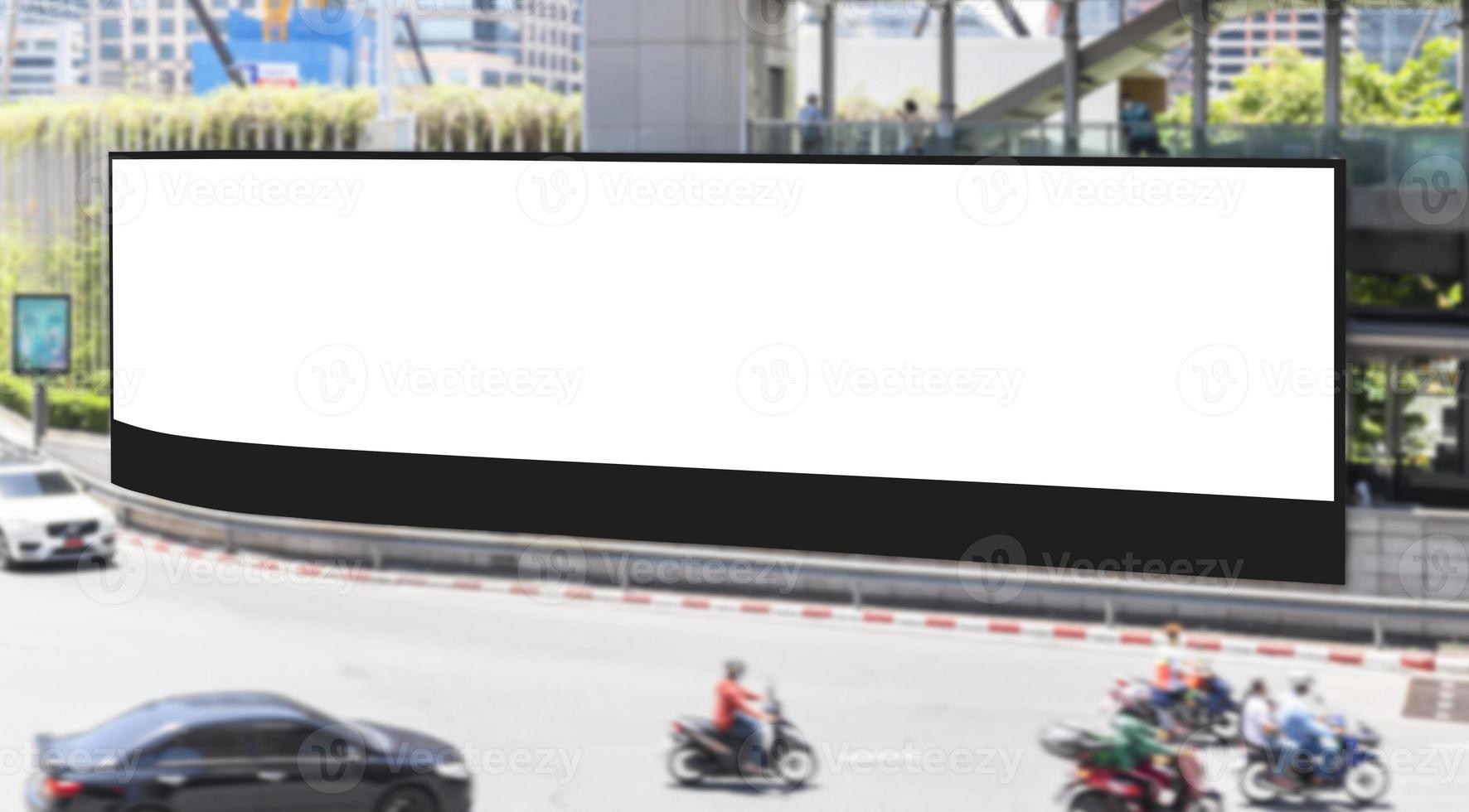 Outdoor LED wall billboard with mock up white screen at crossroad and clipping path photo