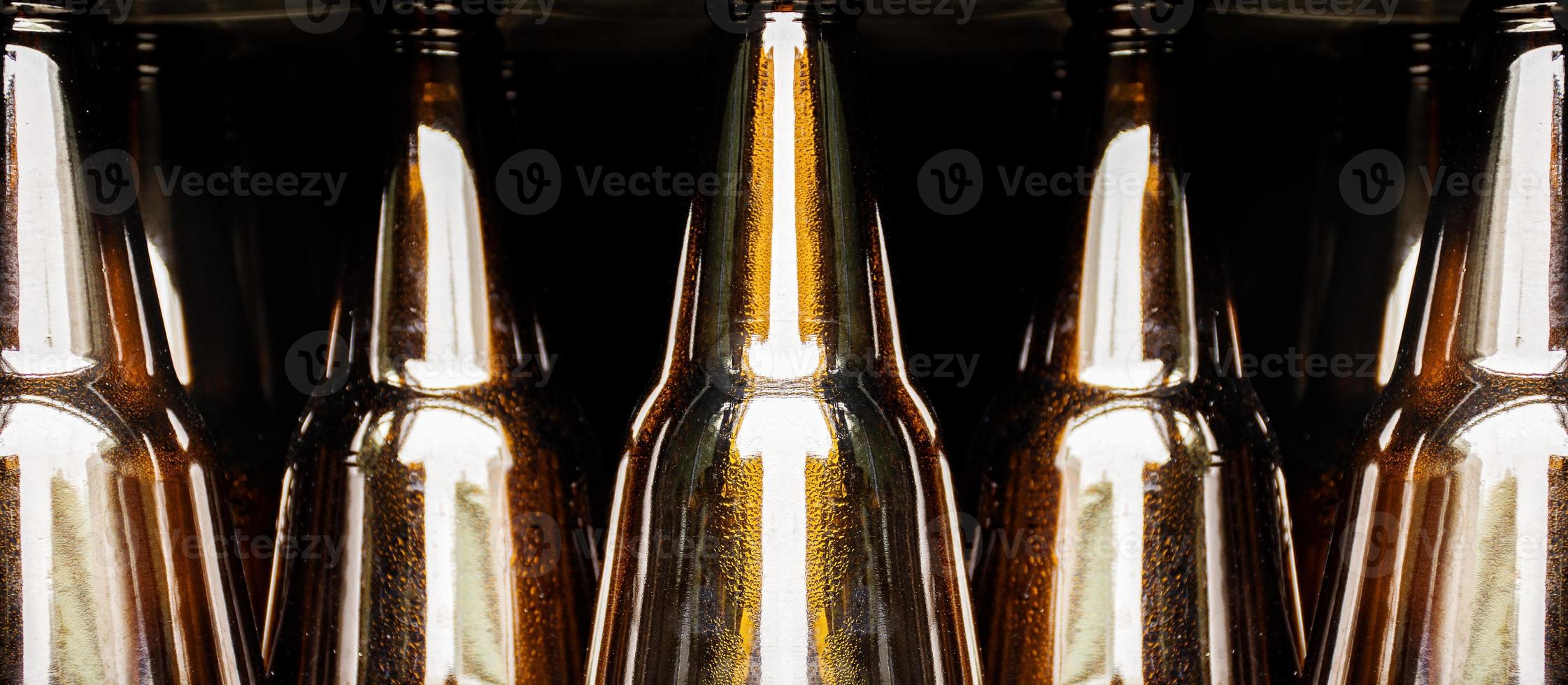 Close up beer bottle in pallet for brewing in industrial plants photo