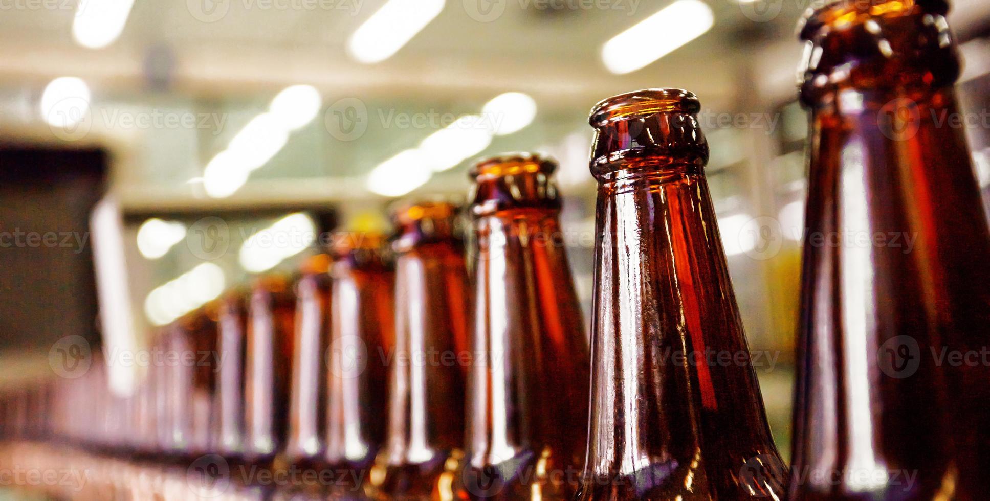 Beer bottle in conveyor belt photo