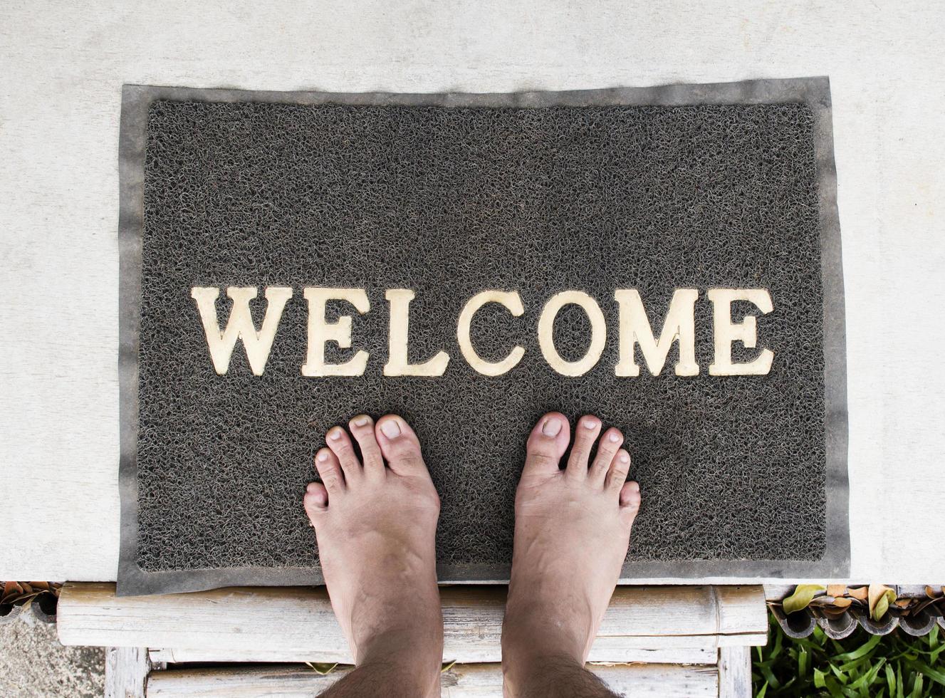 Overhead view of welcome mat outside photo