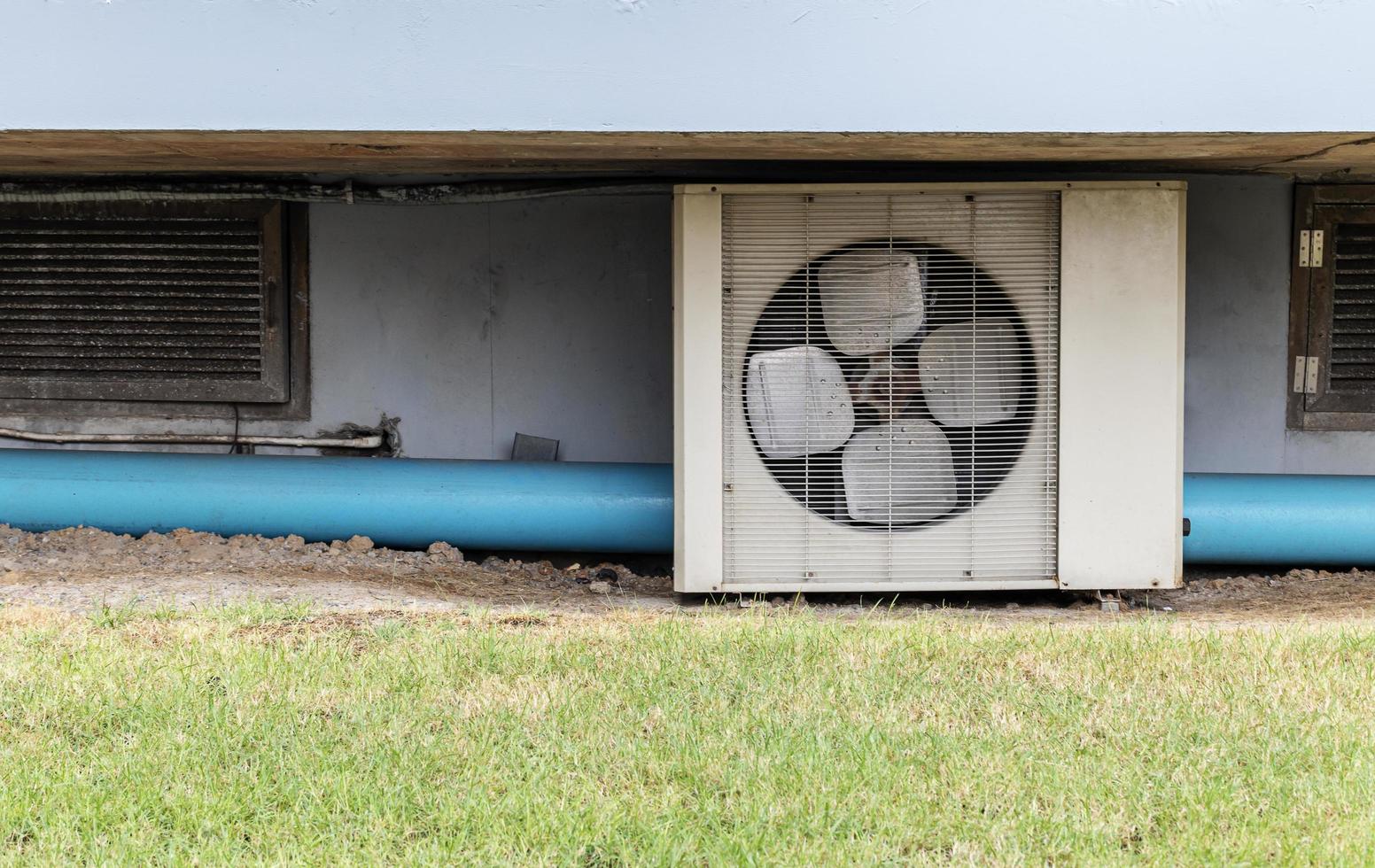 Air conditioner compressor installed under floor photo