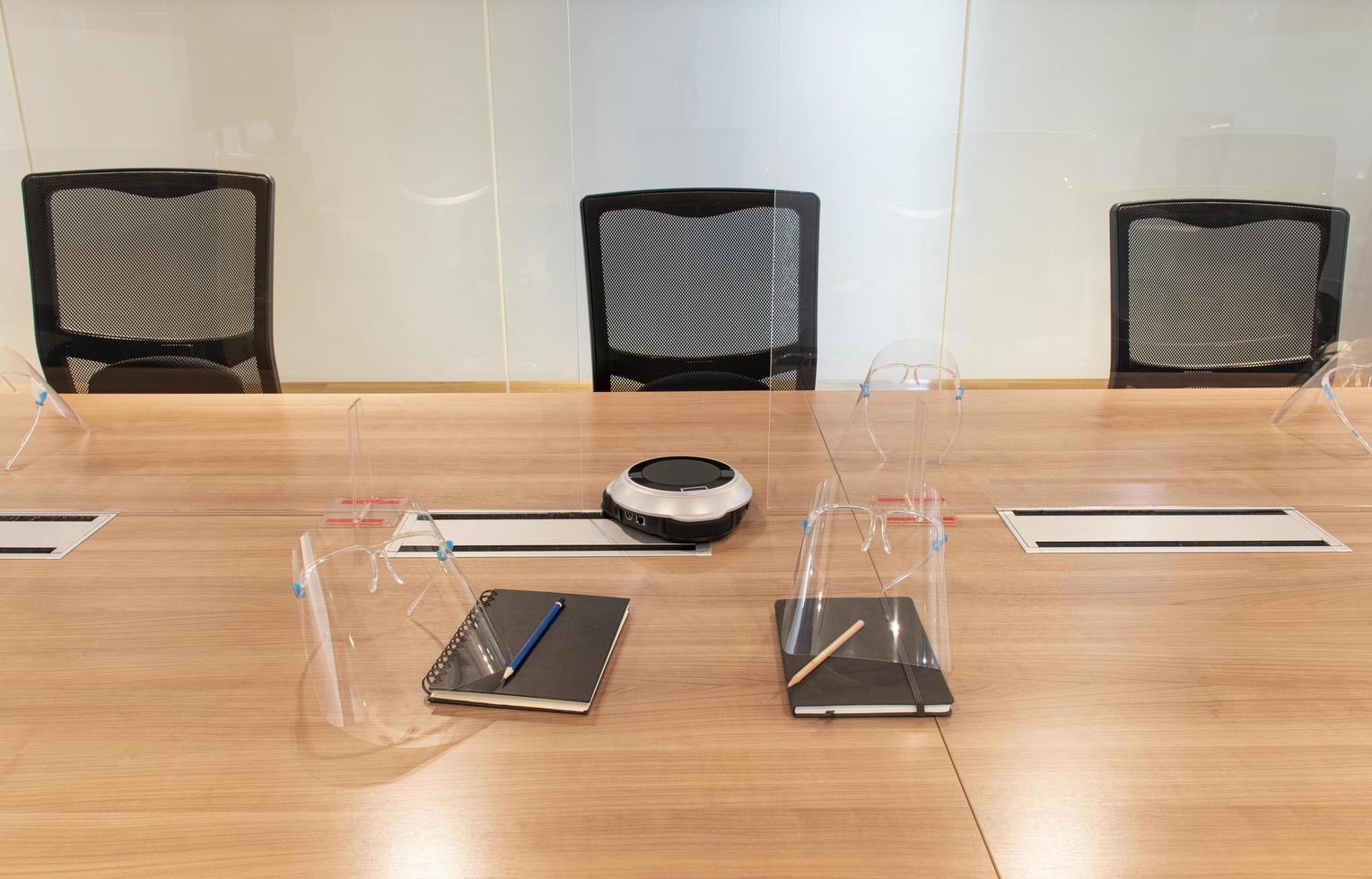 Three armchair with face shield and acrylic sheet center on table prevent COVID19 in meeting room photo