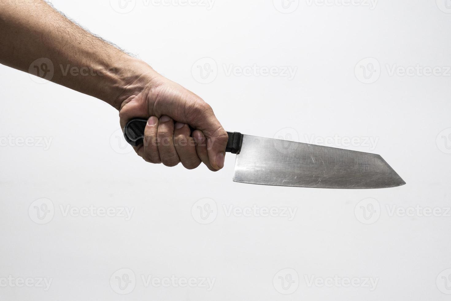 Hand holding a sharp knife intimidating photo