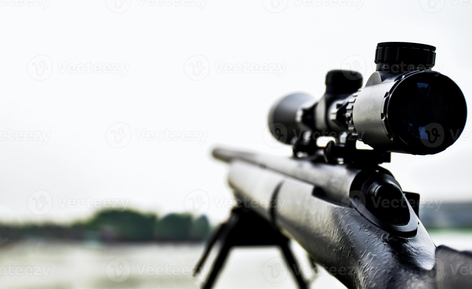 Rifle with a scope and bipod with first person shooter photo