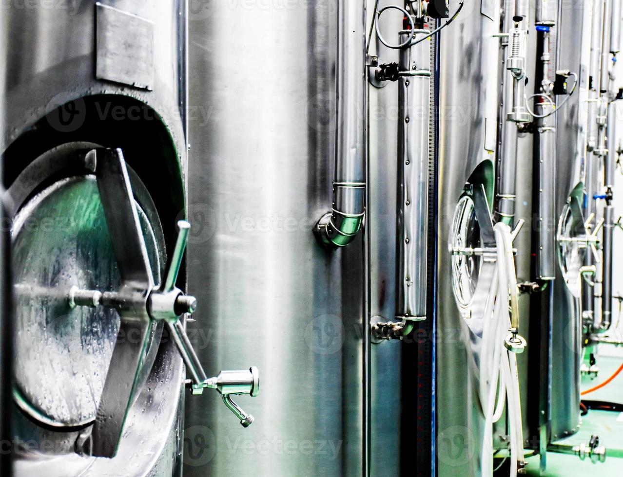 Small beer fermentation tank in temperature control room photo