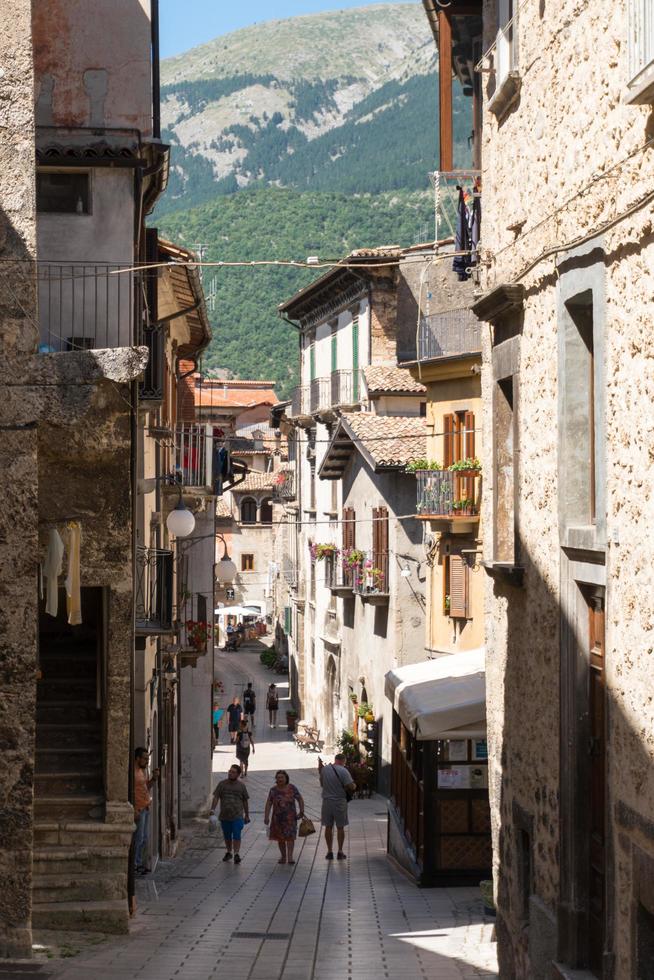 Scanno, Italy-august 8, 2021-Strolling through the narrow streets of Scanno, one of the many ancient villages of Italy during a summer day photo