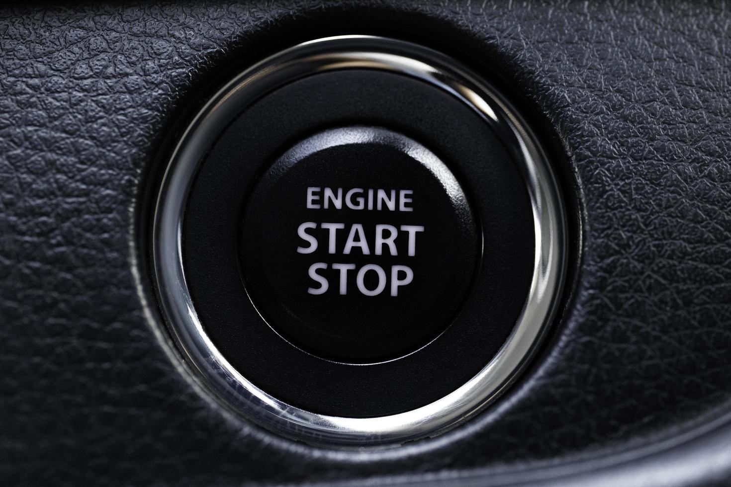 Engine start stop button of a car, macro close up short. photo