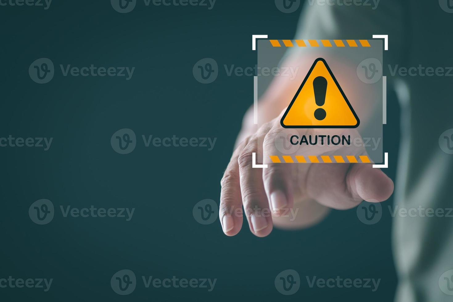 Young man pointing at exclamation mark icon, warning label concept, safety warning sign, maintenance error message, warning system problem should be careful. photo
