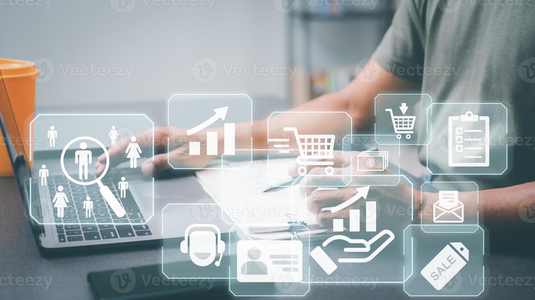 Entrepreneurs work on laptops that feature customer analytics icons, marketing plans and marketing strategies, customer behavior and purchase analysis, and customer research in various aspects. photo