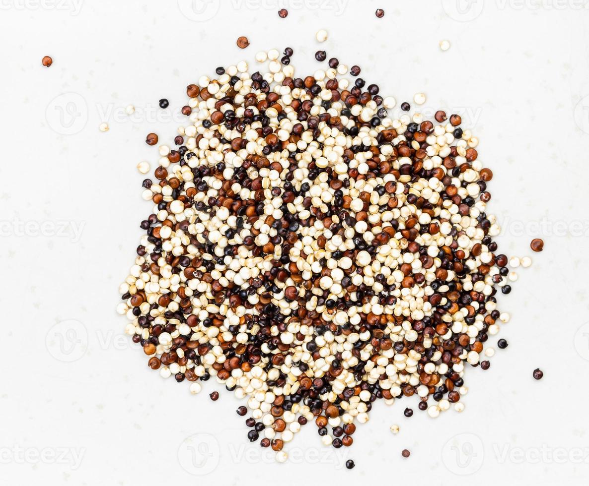pile of blend of quinoa grains close up on gray photo