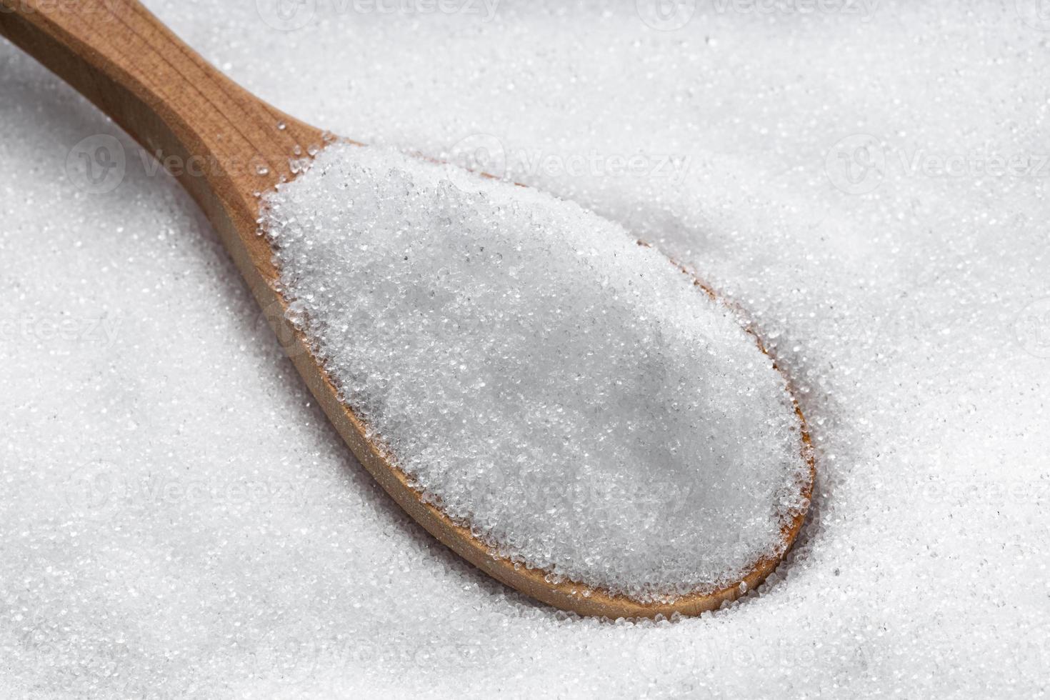 wooden spoon with crystalline erythritol sugar photo