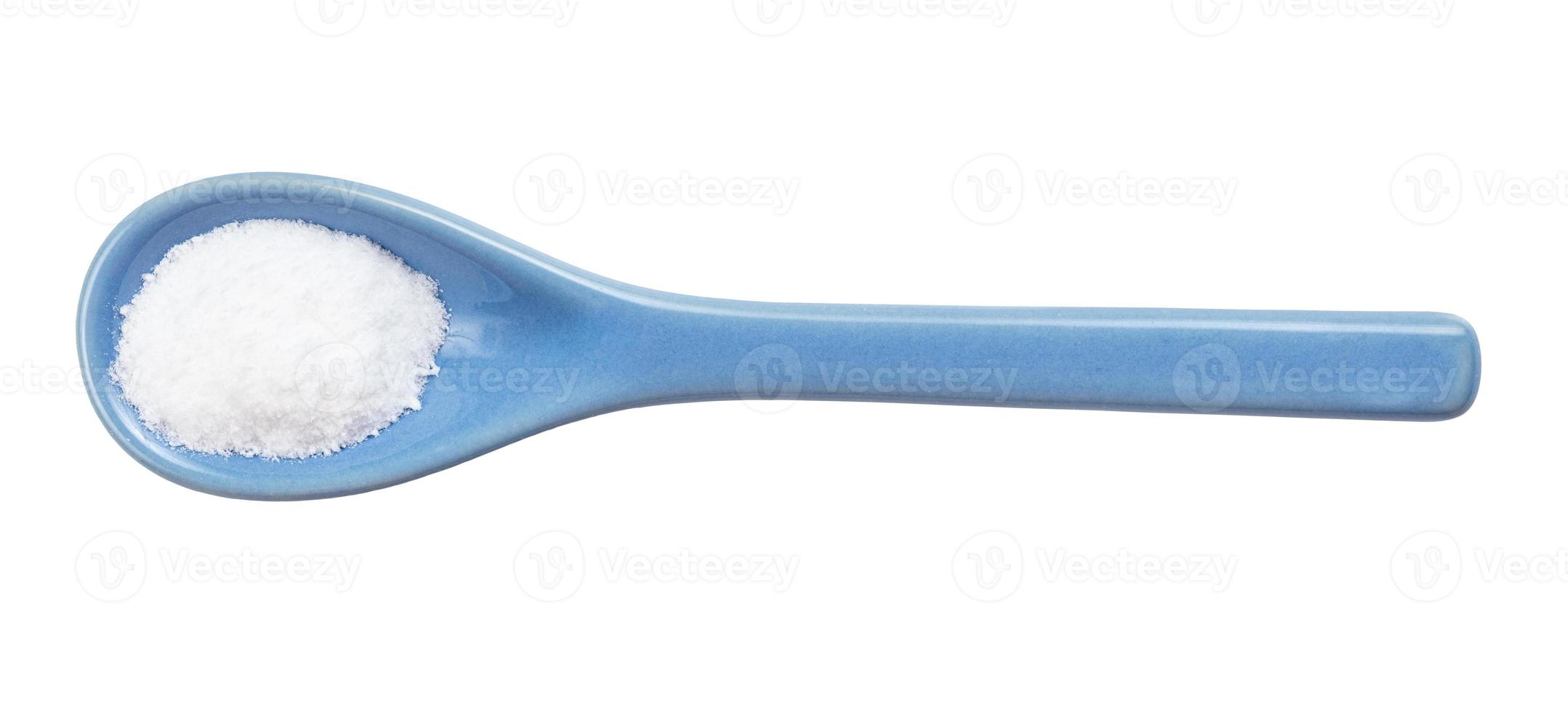 view of vanillin powder in ceramic spoon isolated photo