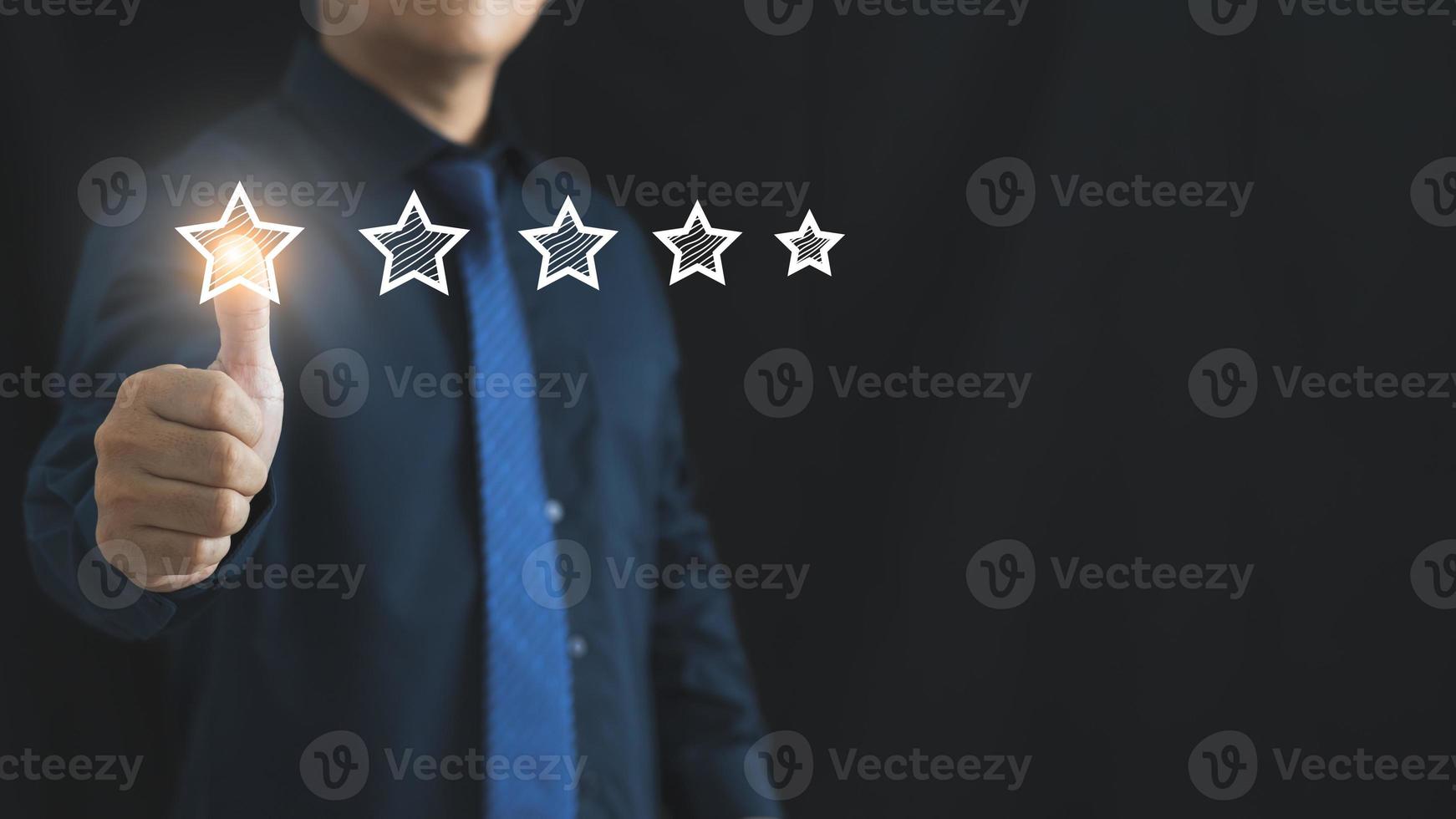 Customer service and Satisfaction concept ,Business people are touching the virtual screen on the star icon to give satisfaction in service. rating very impressed. photo