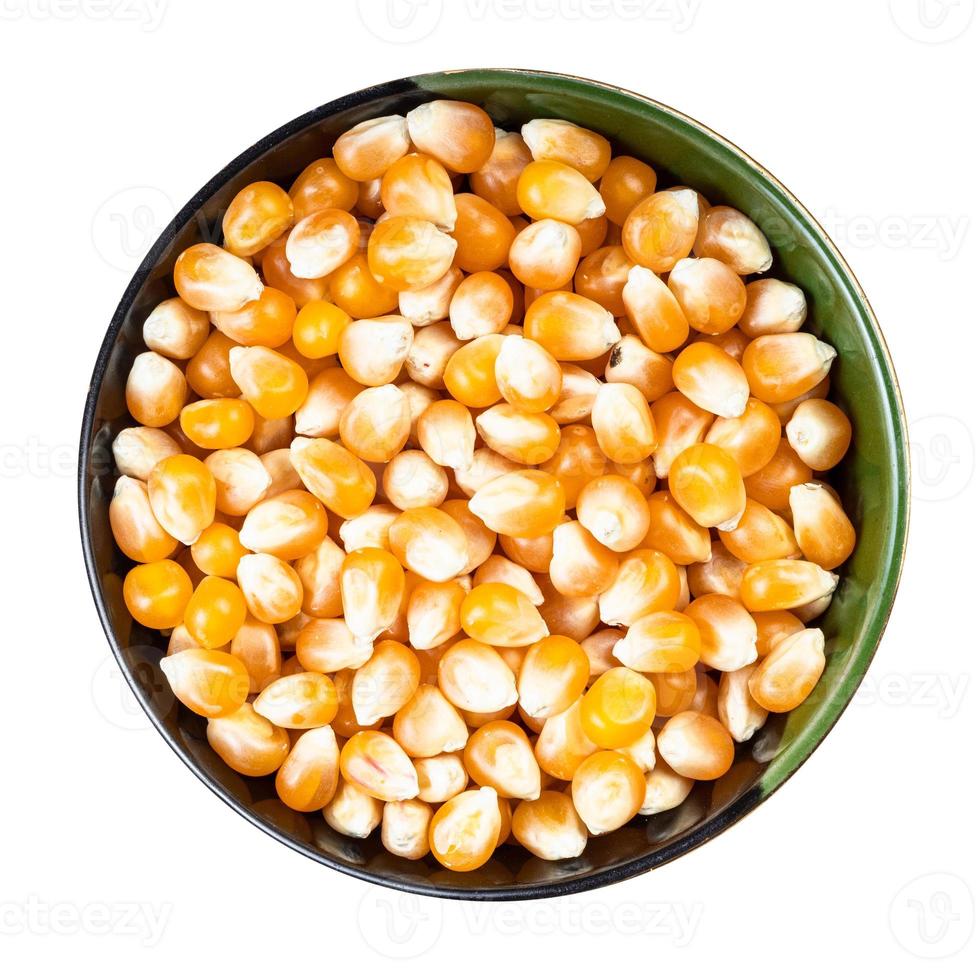 raw maize corns in round bowl isolated on white photo