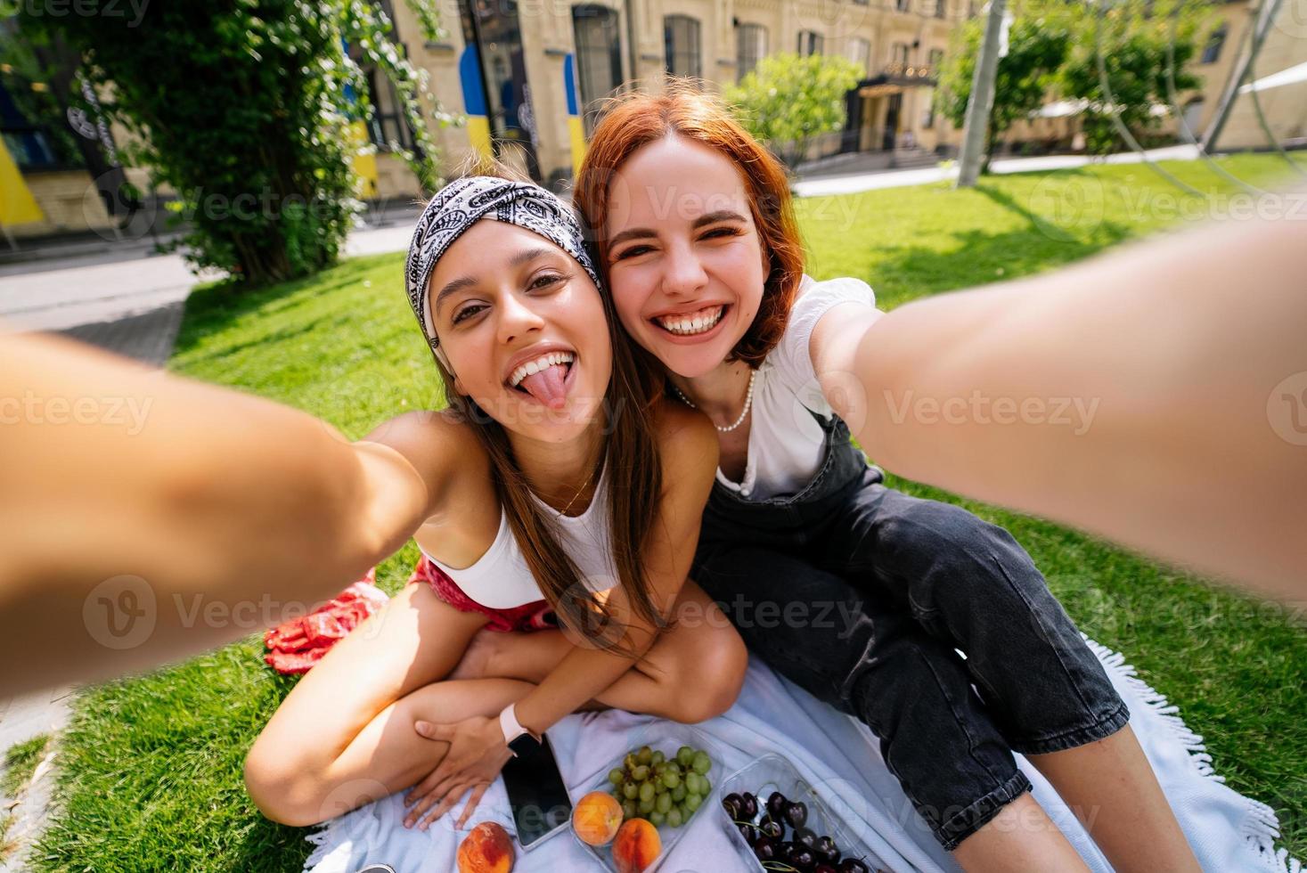 Beautiful women takes a picture with a wonderful park view photo