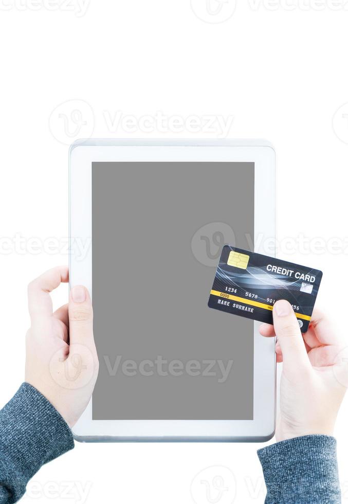 Close up of women hand holding credit card with tablet computer blank space screen photo