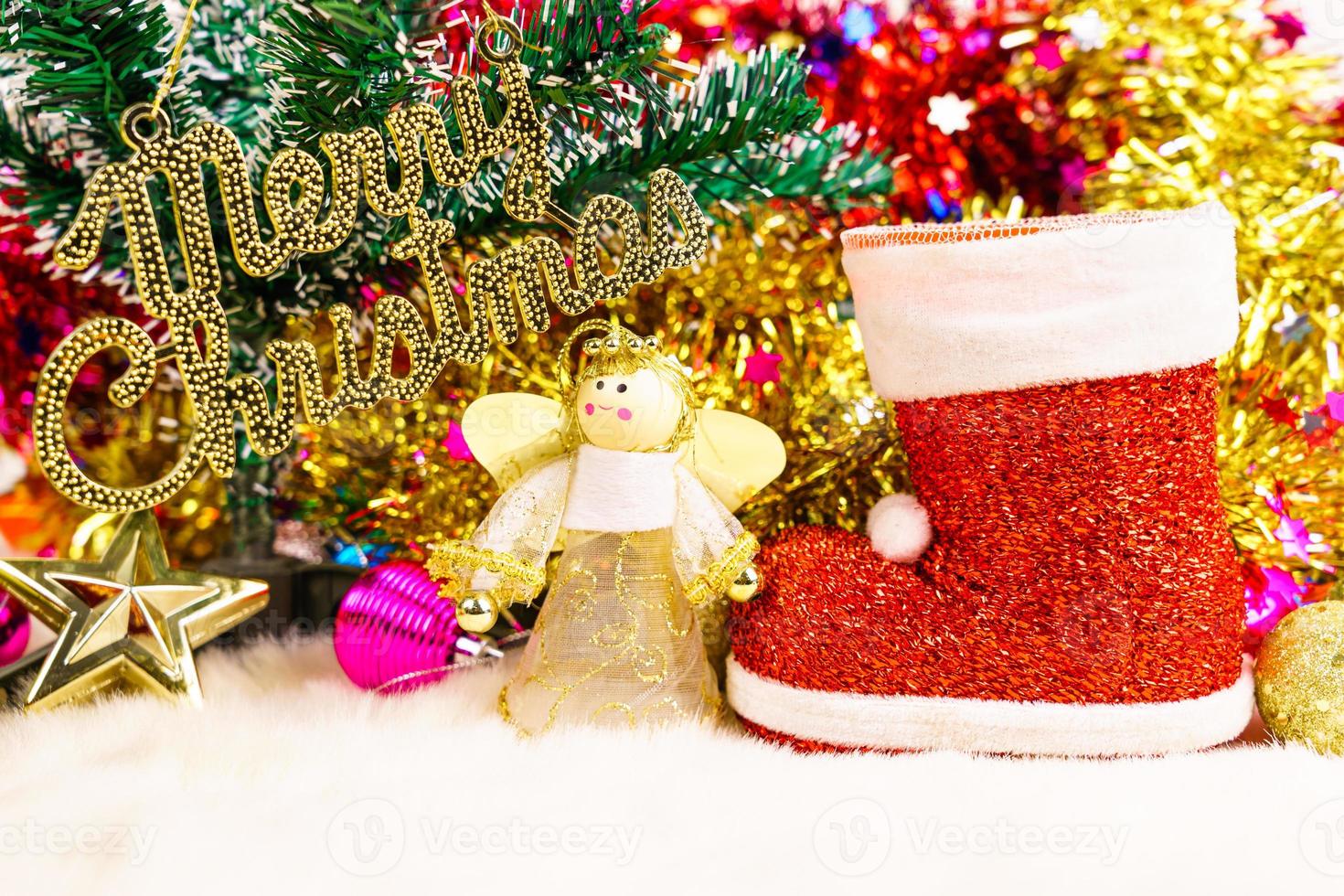 Red Santa claus boot and chrismas doll photo