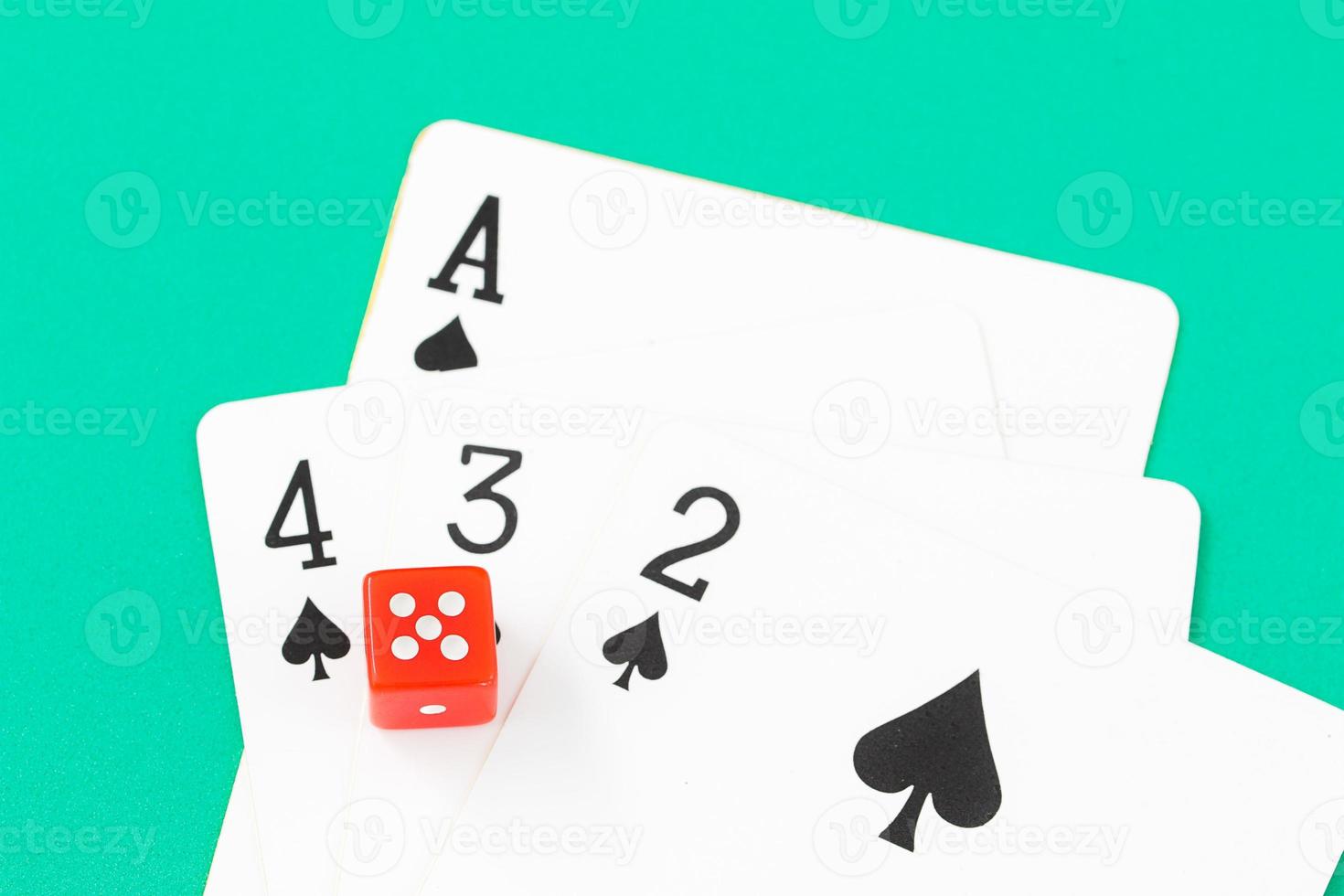 Dices and cards on green casino table photo