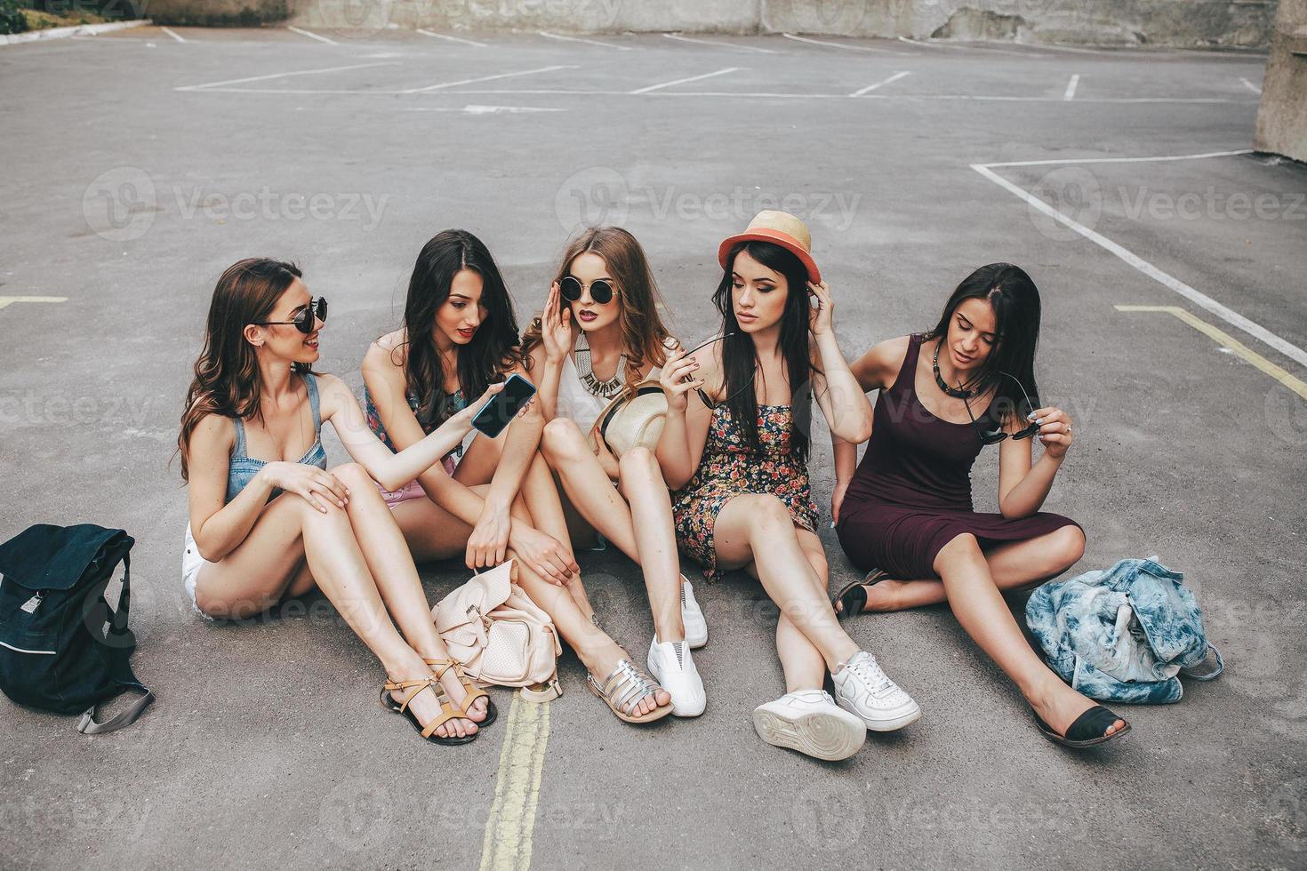 Five beautiful young girls relaxing photo