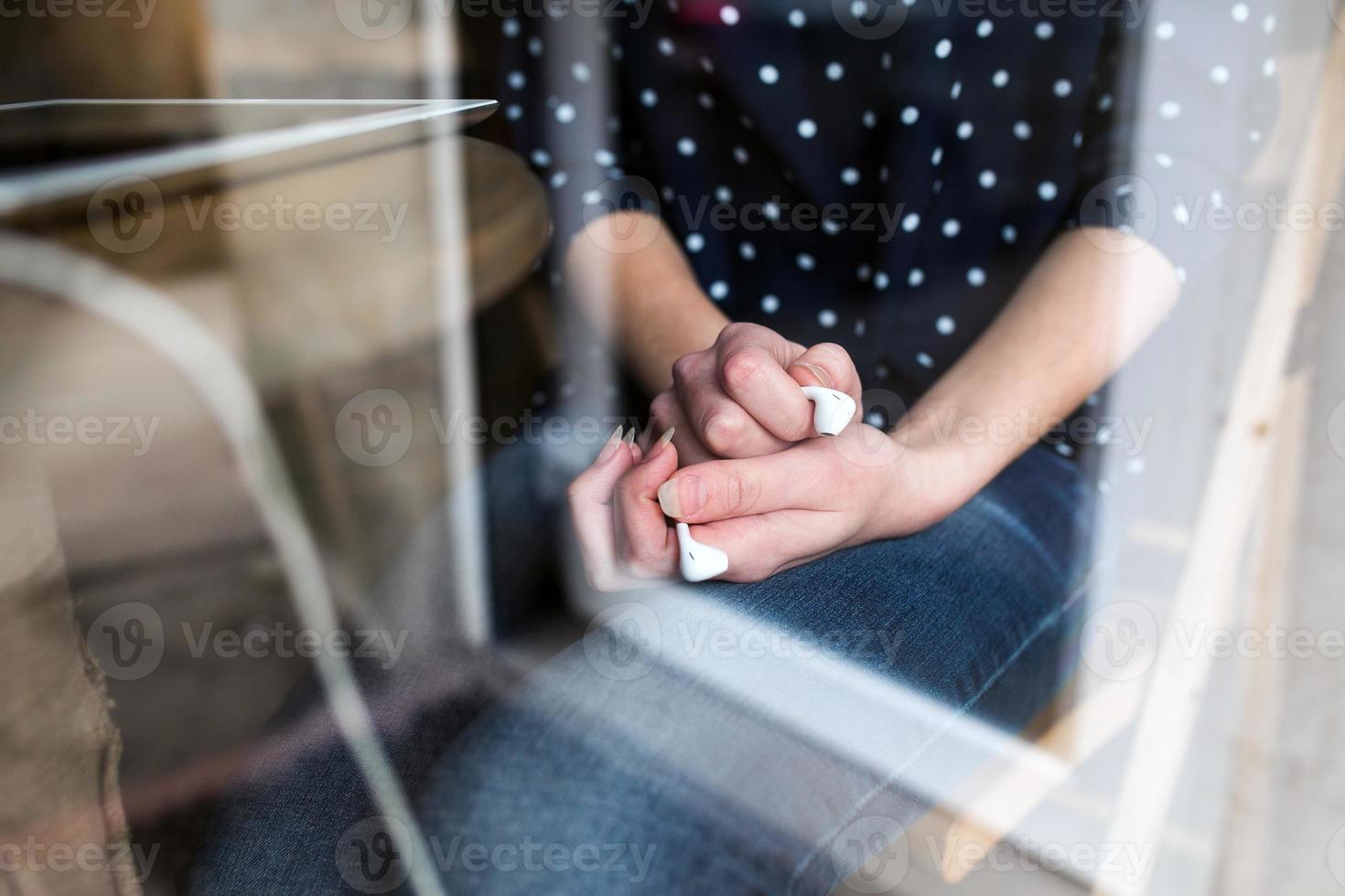 Beautiful girl holding headphones in hands photo