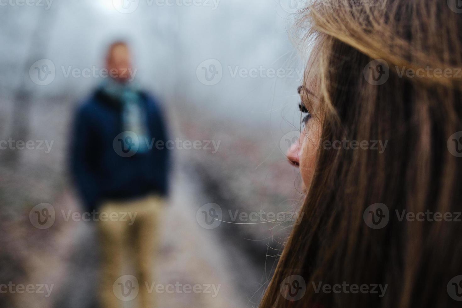 couple walking on a winter park photo