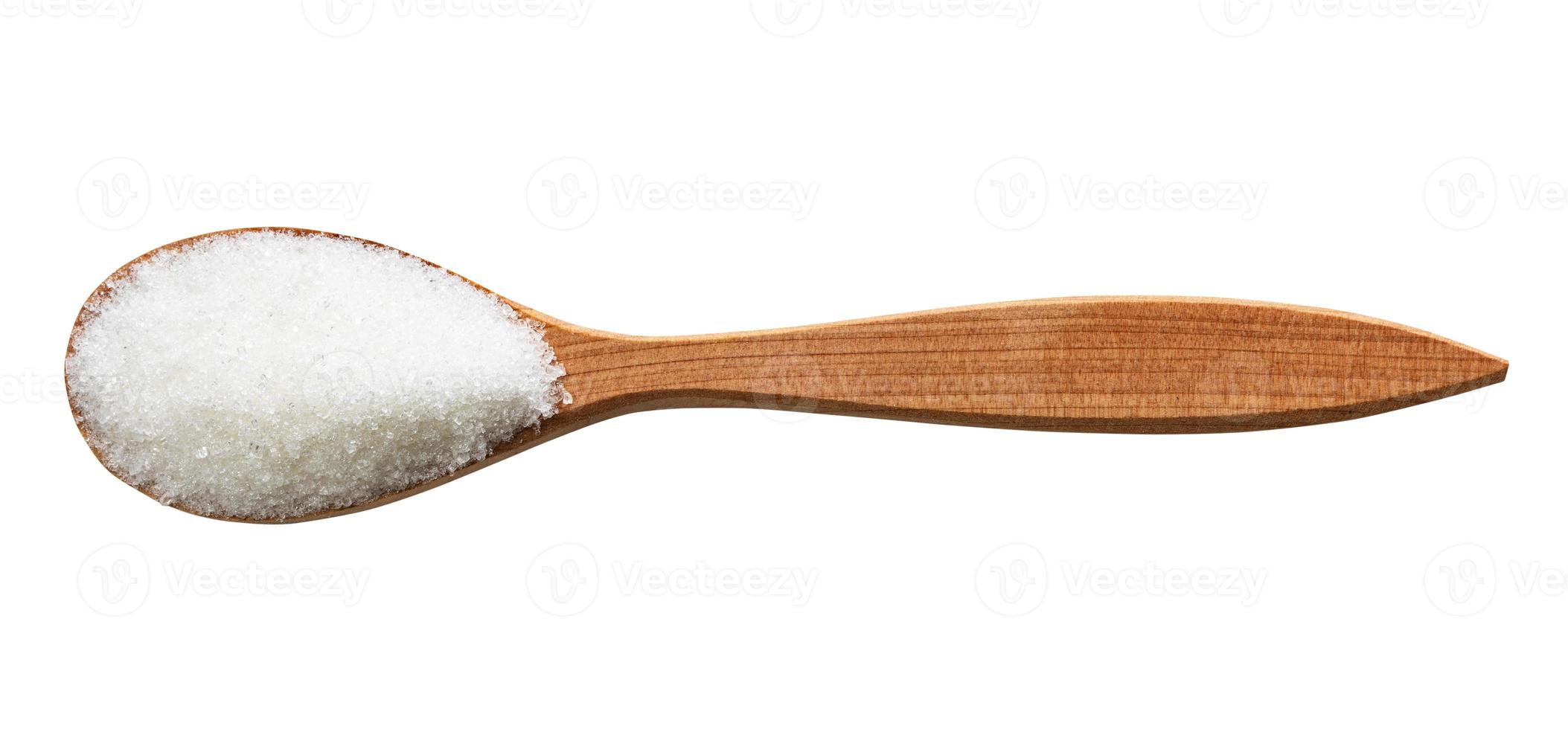 top view of refined sugar in wood spoon isolated photo