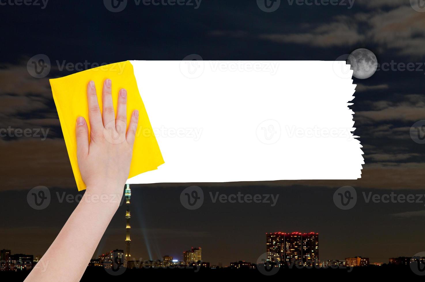 hand deletes night city by yellow rag photo