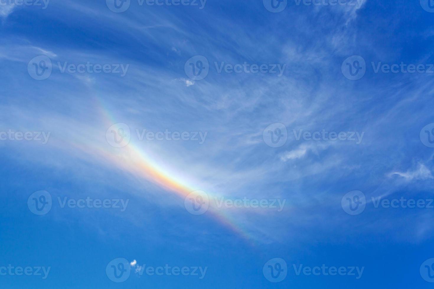 rainbow in blue summer sky photo