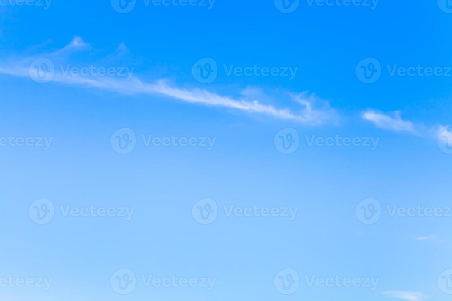 clear blue sky with narrow white cloud in morning photo