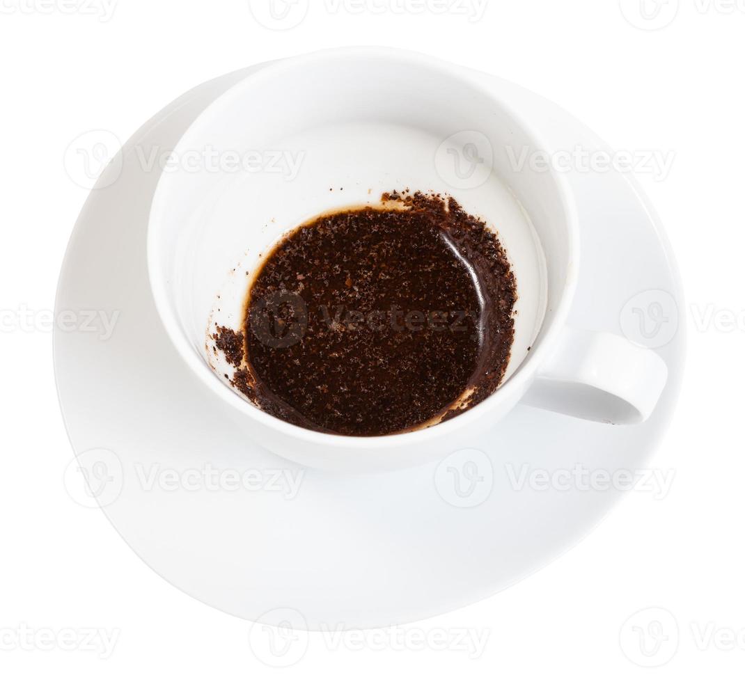 the rest of the coffee drink on the bottom of cup photo