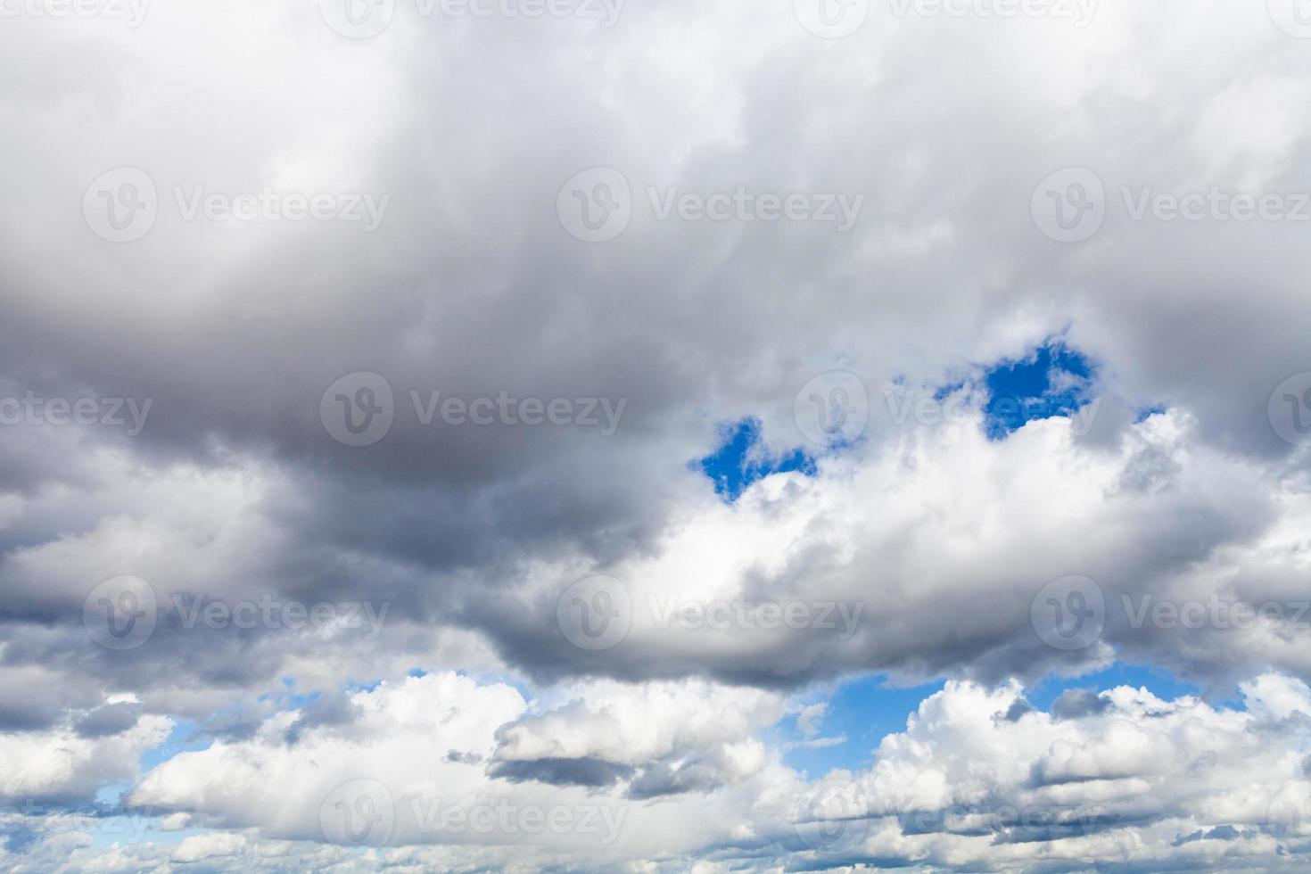 low large cumulus clouds in blue sky in september photo