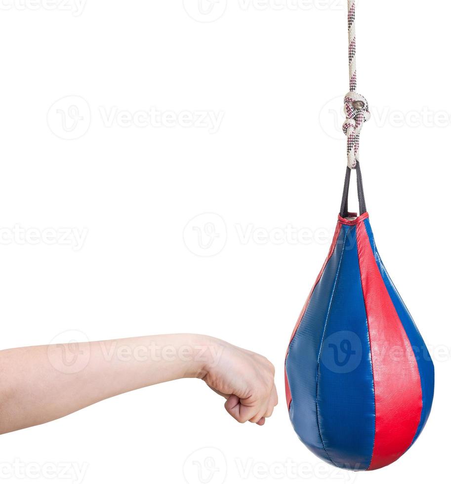 kid hand punches punching bag isolated photo