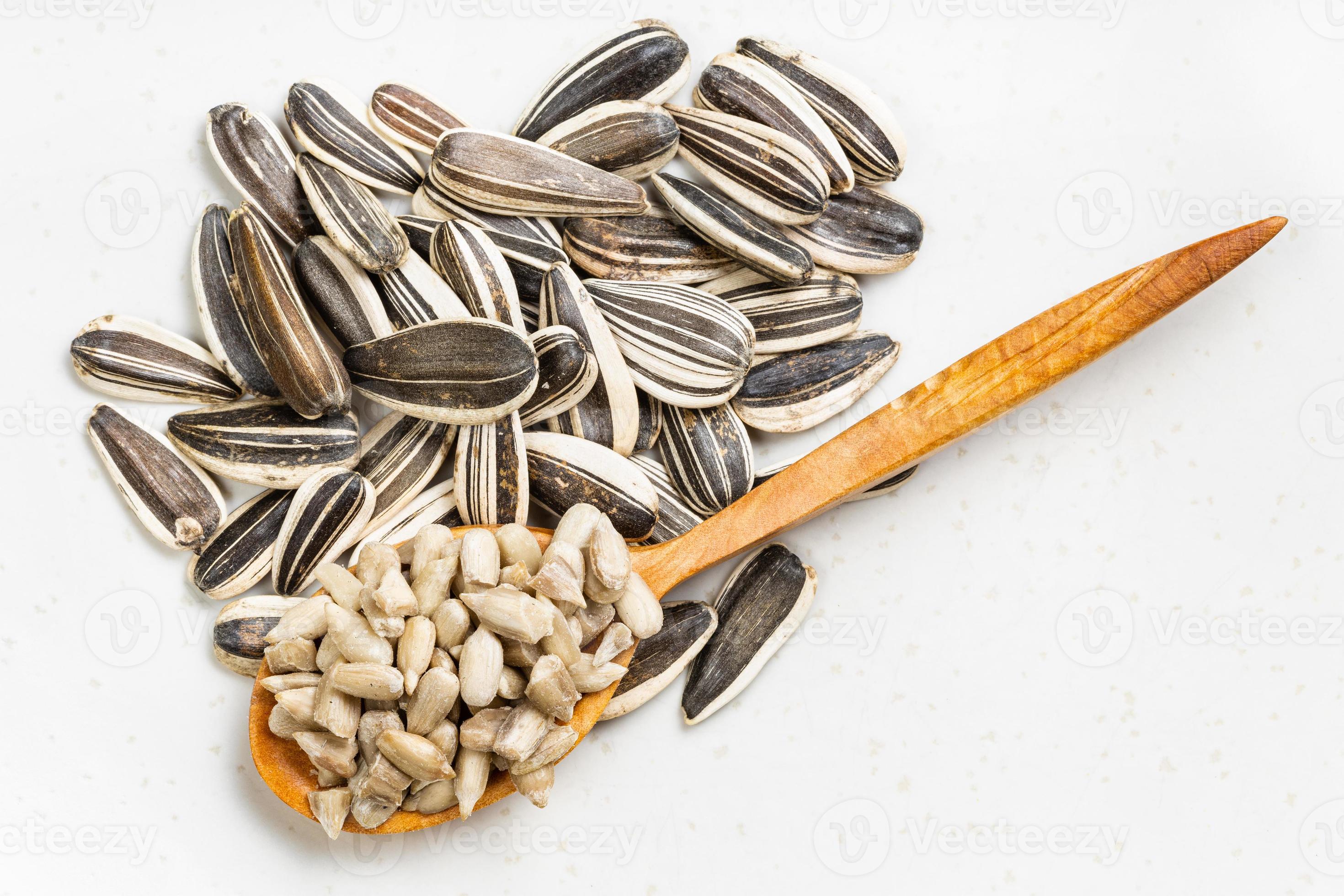 top view of cores and pile of sunflower seeds 11393984 Stock Photo at ...