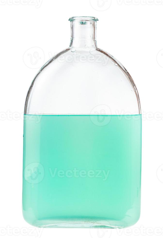 solution of green watercolour in glass flask photo