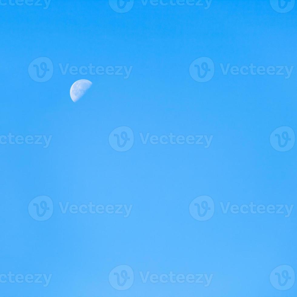 moon in clear blue autumn morning sky photo