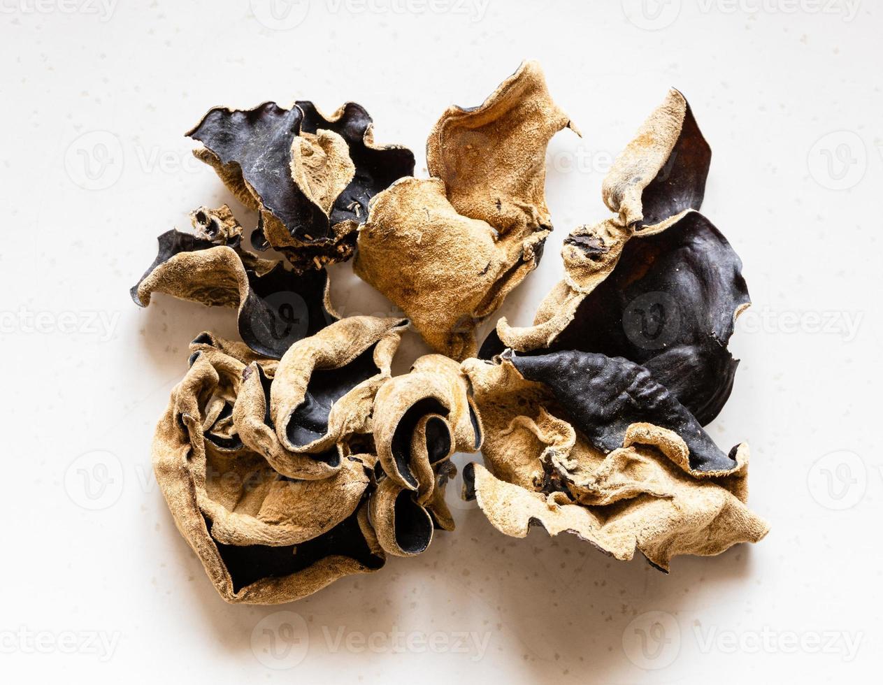 several dried chinese wood ear fungus on gray photo