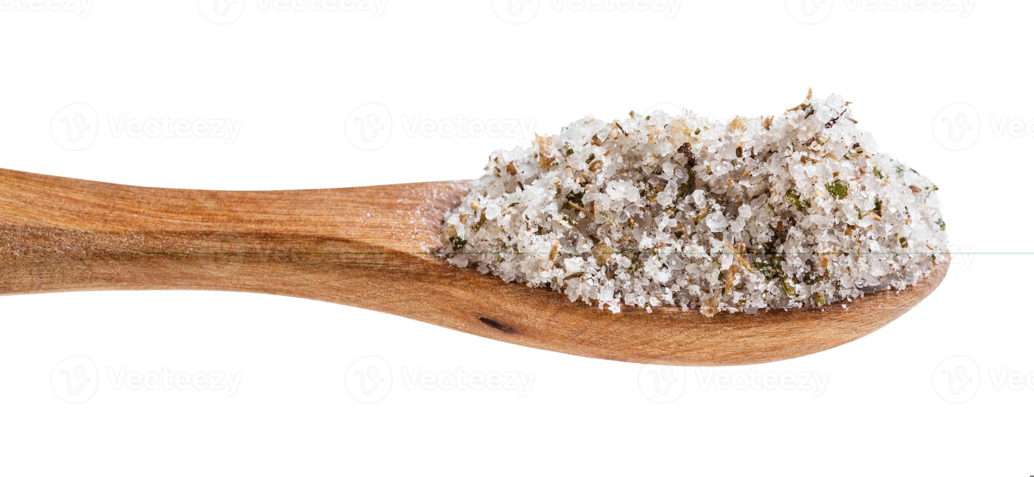 wooden salt spoon with seasoned salt close up photo