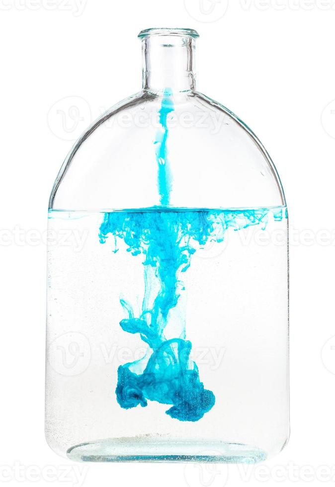 blue ink dissolves in water in flask isolated photo