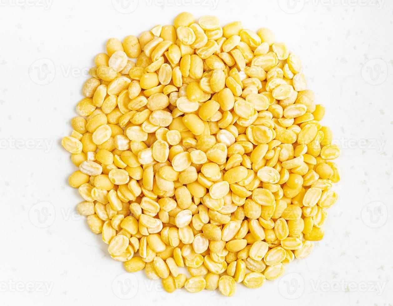 pile of raw moong dal split green mung beans photo